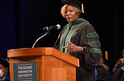 Dr. LaQuandra Nesbitt speaking from a podium